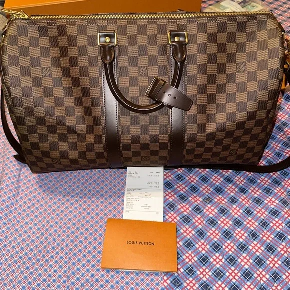 Louis Vuitton keepall duffle. Carried twice. $1500 - Picture 2 of 5